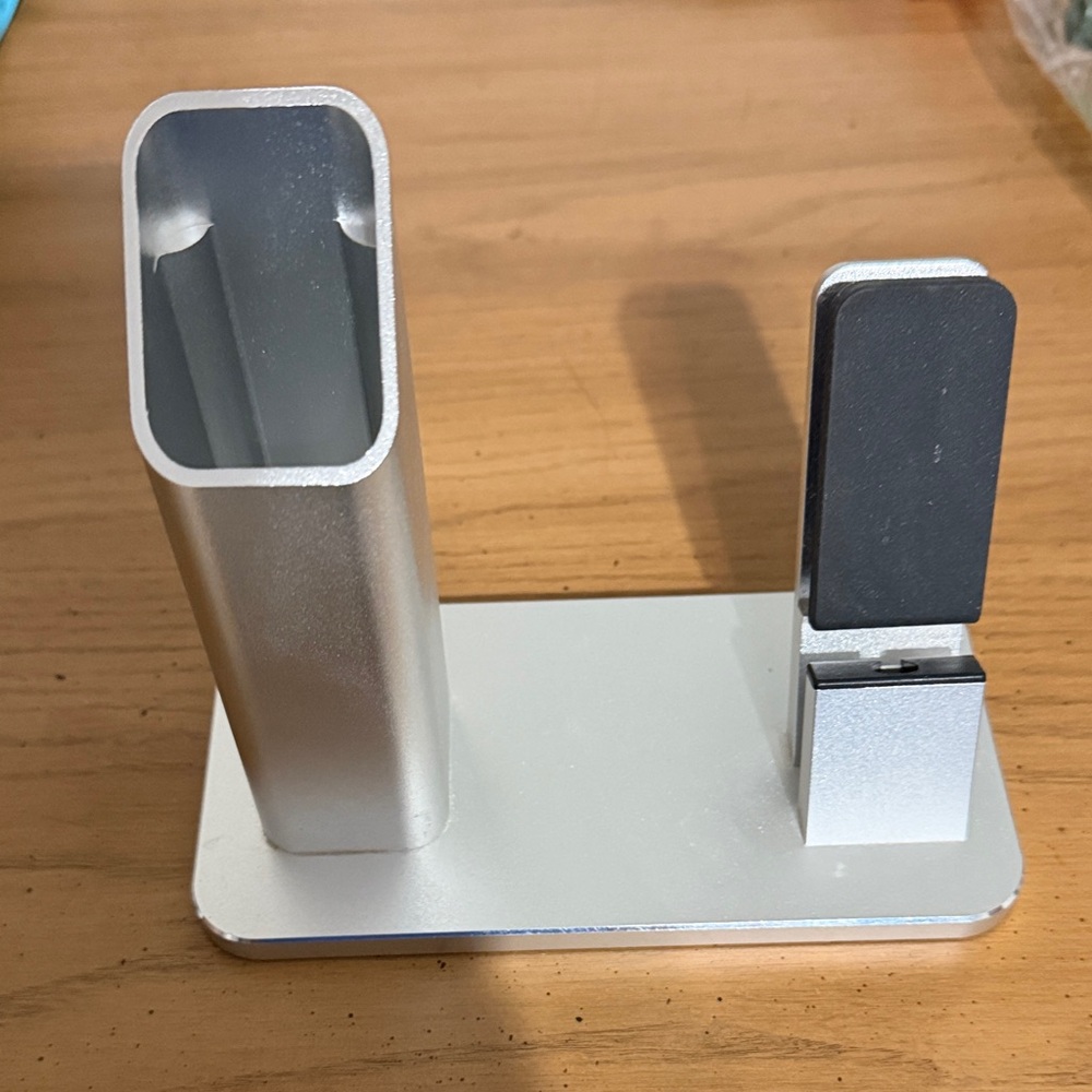 Silver and Black Electronics Stand